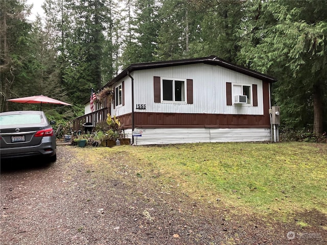 view of property exterior with a lawn