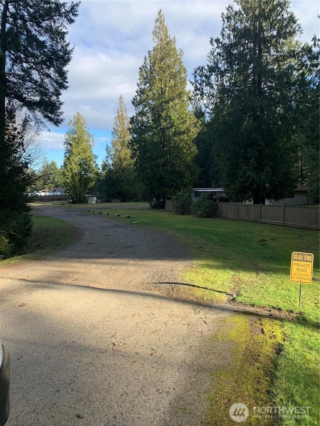 exterior space with dirt driveway