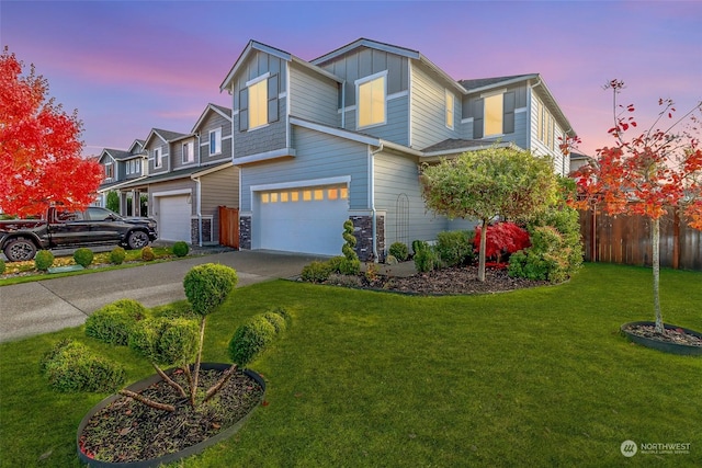 view of front facade featuring a yard and a garage