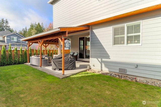 exterior space featuring an outdoor living space, a yard, and a patio area