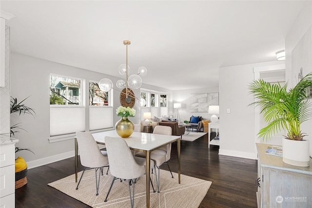 dining space featuring a chandelier and dark hardwood / wood-style flooring