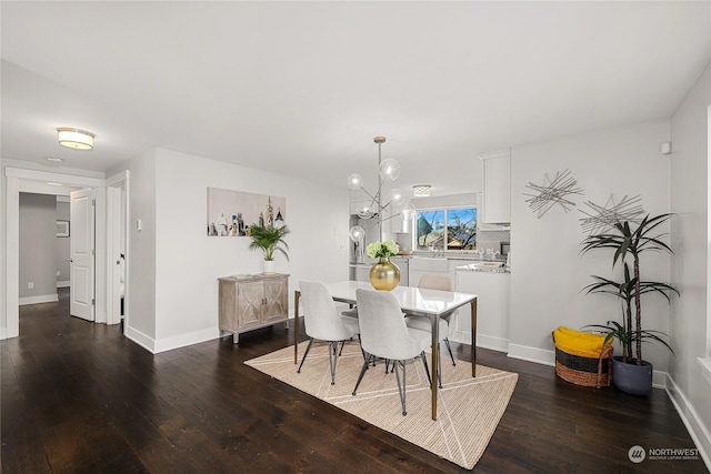 dining area featuring an inviting chandelier and dark hardwood / wood-style floors