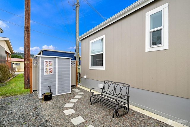 view of patio with a shed