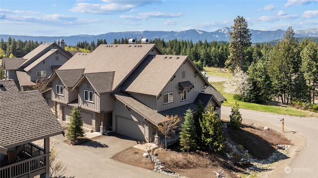 birds eye view of property featuring a mountain view