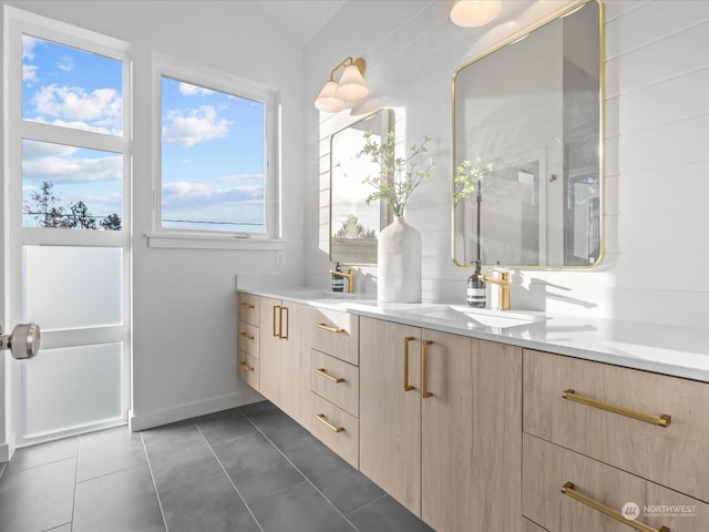 bathroom with tile patterned floors and vanity