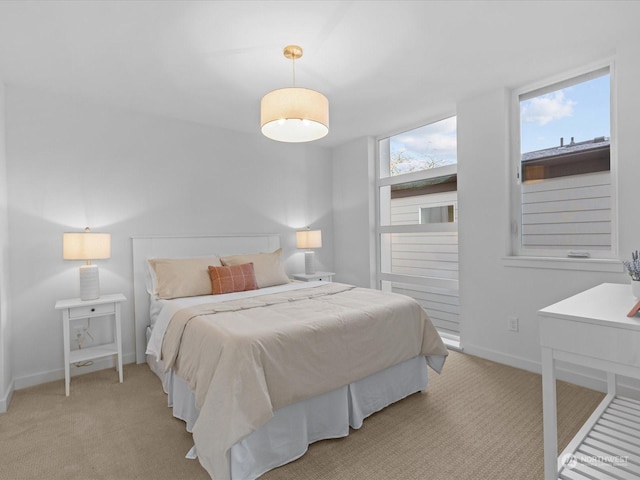 bedroom with light colored carpet