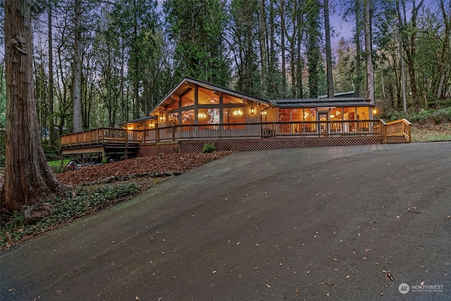 view of front of home with a wooden deck