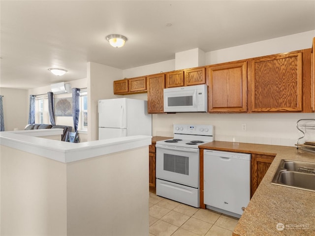 kitchen with sink, light tile patterned floors, white appliances, and an AC wall unit