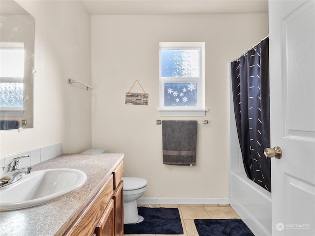 full bathroom featuring shower / bath combination with curtain, tile patterned floors, toilet, and vanity