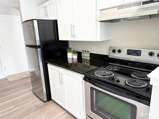 kitchen featuring white cabinetry, light hardwood / wood-style flooring, stainless steel appliances, and dark stone counters