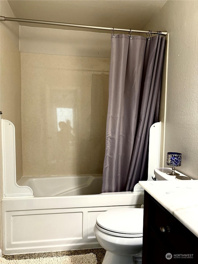 full bathroom featuring shower / tub combo with curtain, vanity, and toilet