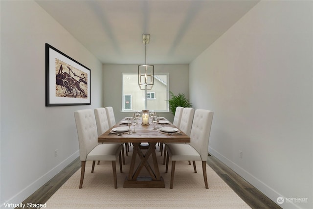 dining space featuring dark wood-type flooring