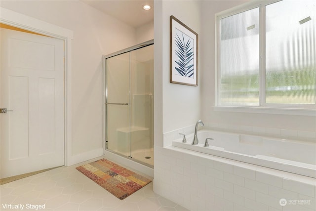 bathroom with plus walk in shower and tile patterned floors