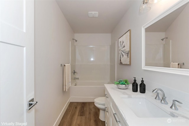 full bathroom with vanity, wood-type flooring,  shower combination, and toilet