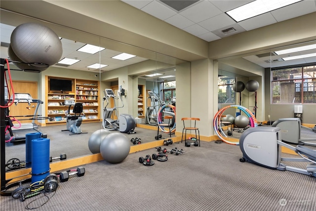 gym featuring a paneled ceiling