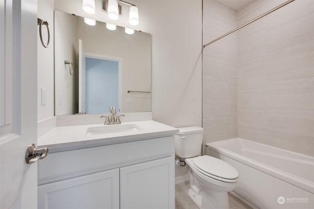 full bathroom featuring vanity, tiled shower / bath, and toilet