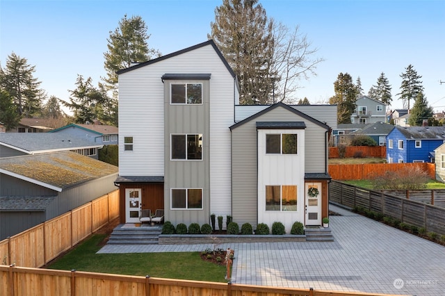 rear view of property featuring a patio area