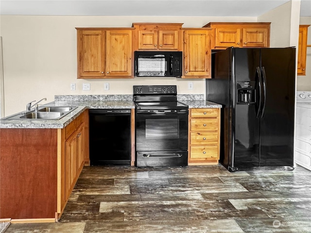 kitchen with dark hardwood / wood-style floors, sink, and black appliances