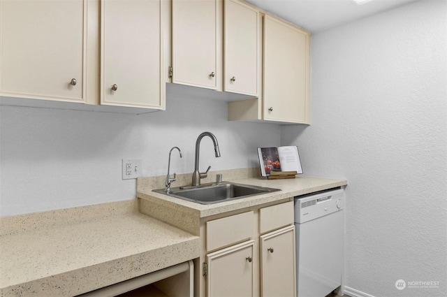 kitchen with white dishwasher, sink, and cream cabinetry