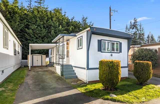 view of home's exterior featuring a shed