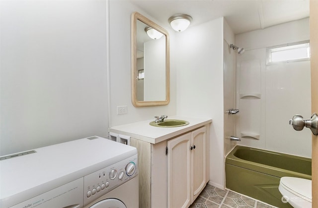 full bathroom with toilet, washer / clothes dryer, tile patterned flooring, vanity, and tub / shower combination