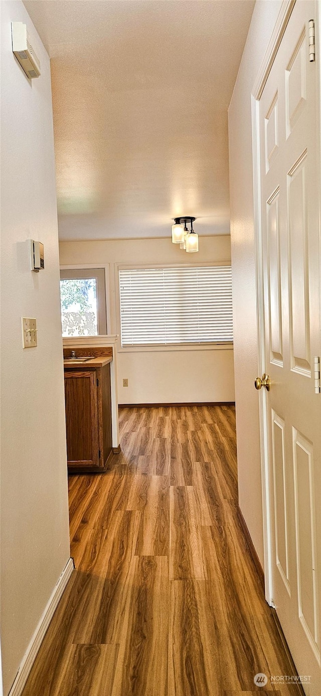 hallway featuring dark wood-type flooring