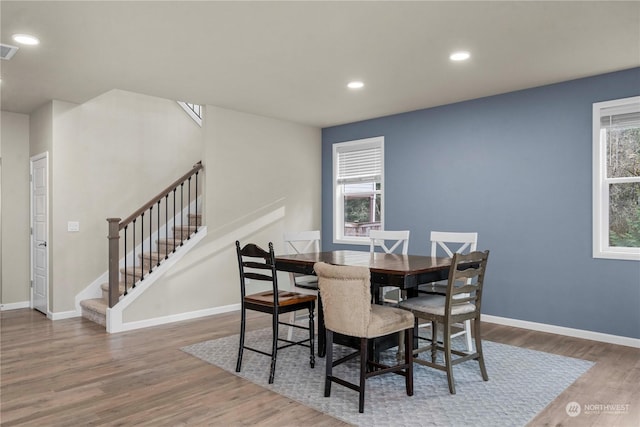 dining room with dark hardwood / wood-style floors