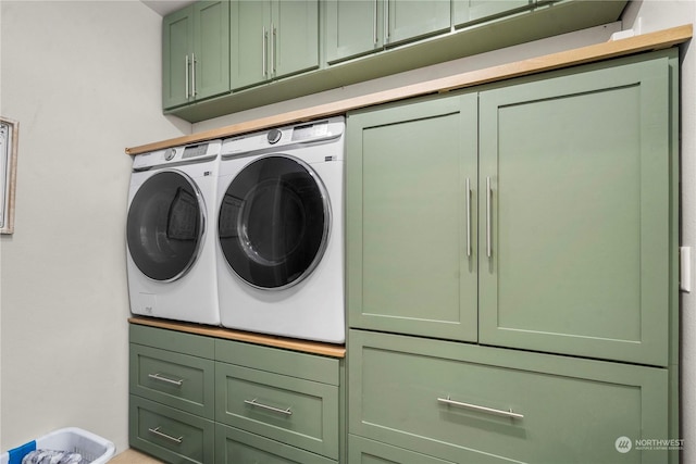 laundry area featuring cabinets and washer and dryer