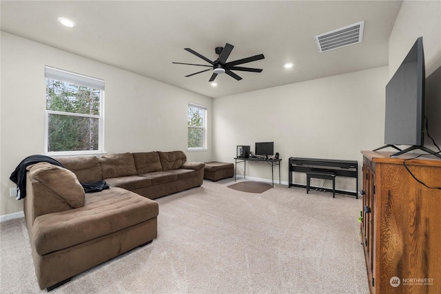 living room featuring ceiling fan and light carpet