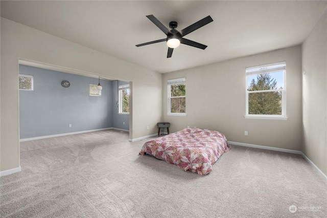 bedroom with ceiling fan and carpet