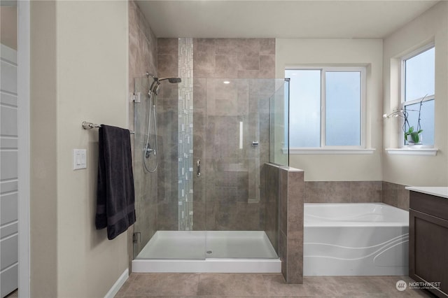 bathroom featuring vanity, tile patterned flooring, and independent shower and bath