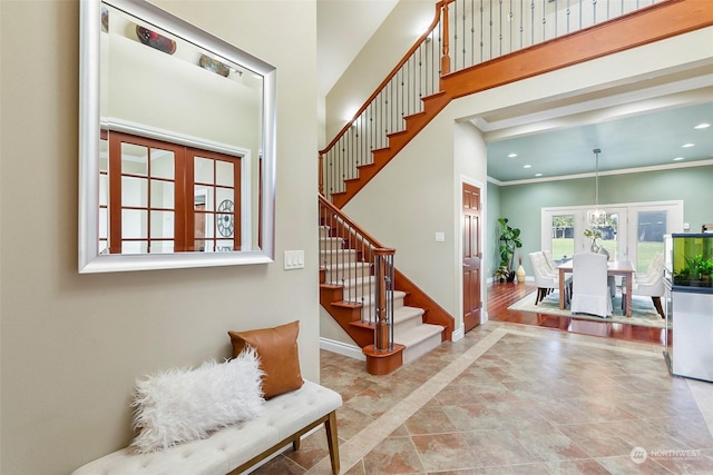 foyer featuring ornamental molding