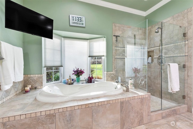 bathroom featuring crown molding, a wealth of natural light, and separate shower and tub