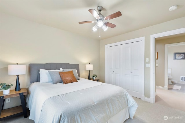 carpeted bedroom with a closet and ceiling fan