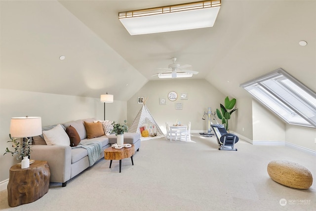 interior space with ceiling fan and vaulted ceiling with skylight