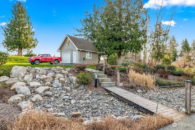 view of yard with a garage and an outdoor structure