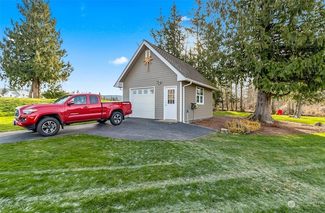 garage featuring a yard