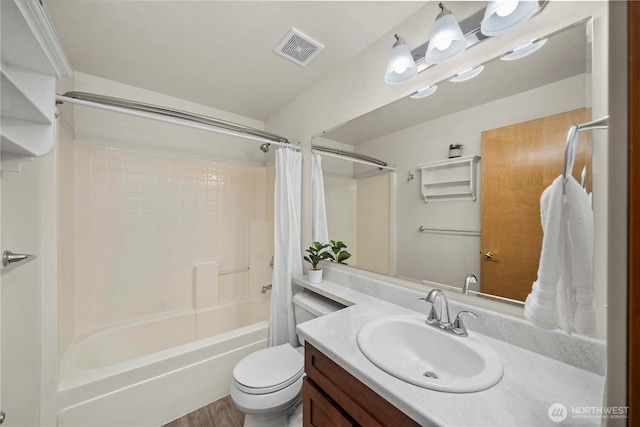 full bathroom featuring vanity, shower / tub combo with curtain, and toilet