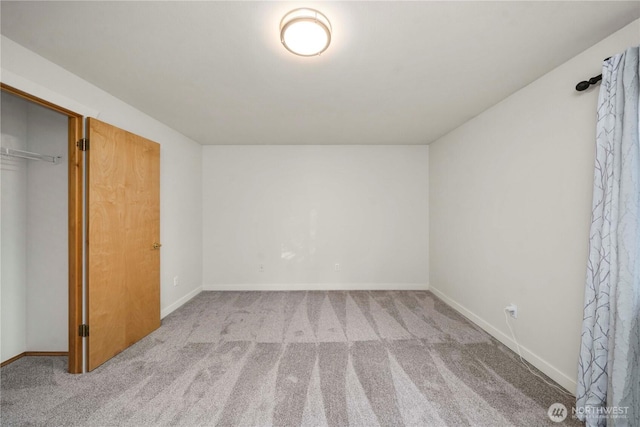 unfurnished bedroom featuring light colored carpet