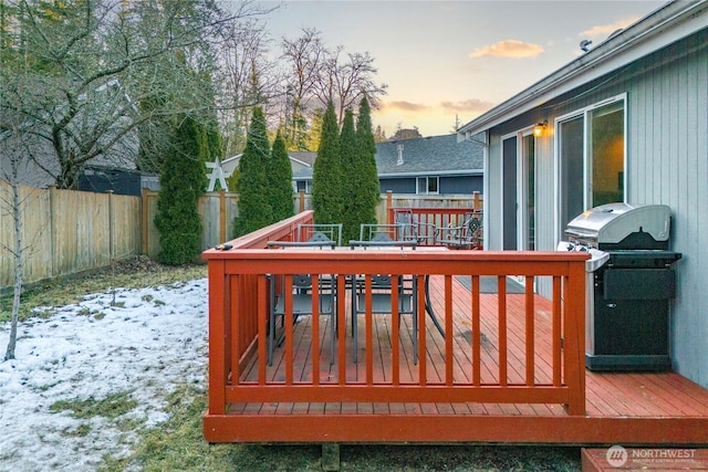 snow covered deck featuring area for grilling