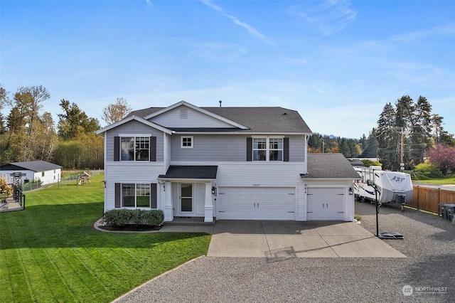 view of front property with a garage and a front yard