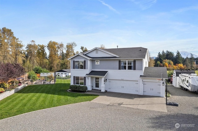 front facade featuring a garage and a front lawn