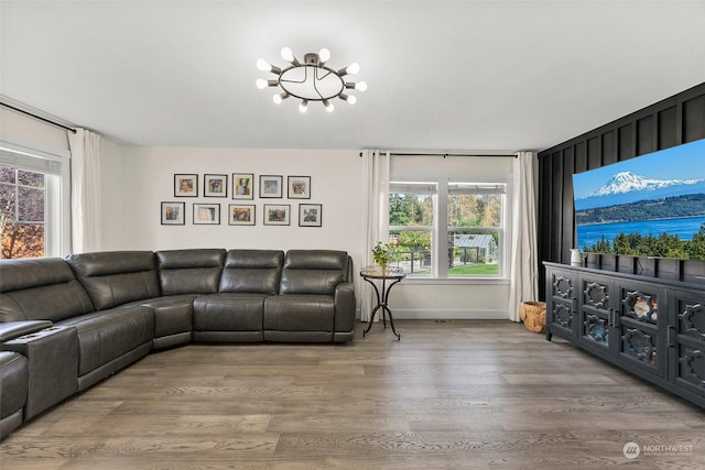 living room featuring hardwood / wood-style flooring and a chandelier