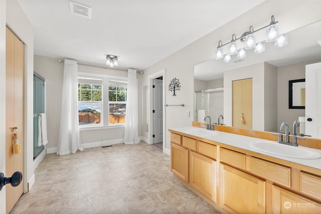 bathroom featuring vanity and walk in shower