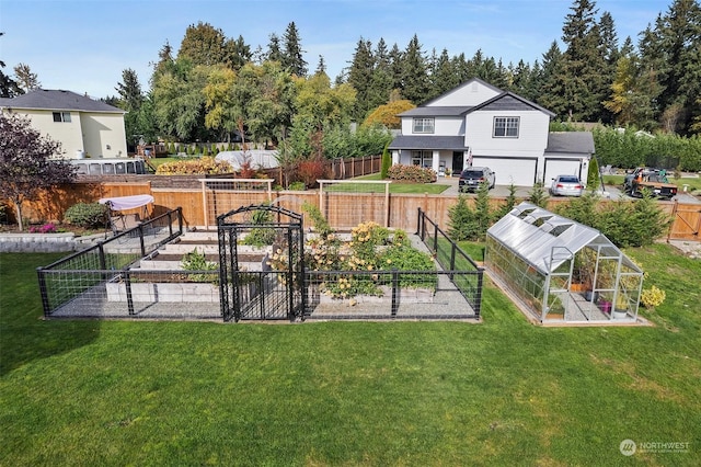 exterior space featuring an outbuilding, a yard, and a garage