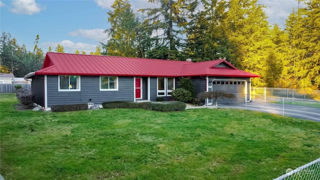 ranch-style house featuring a garage and a front lawn