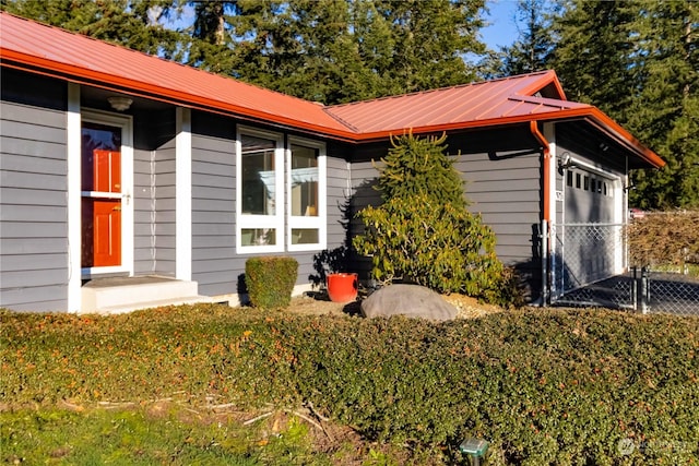 view of side of home featuring a garage