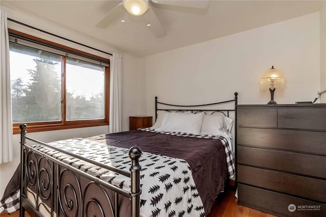 bedroom featuring ceiling fan and wood-type flooring