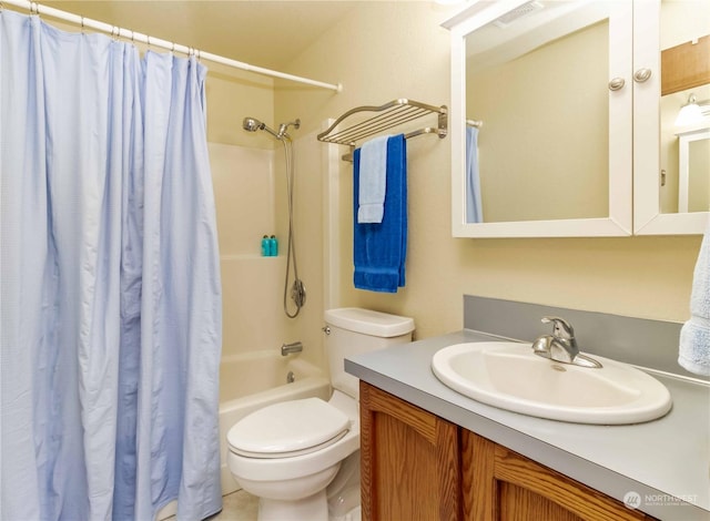 full bathroom featuring vanity, toilet, and shower / tub combo