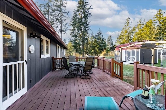 wooden deck featuring a storage shed